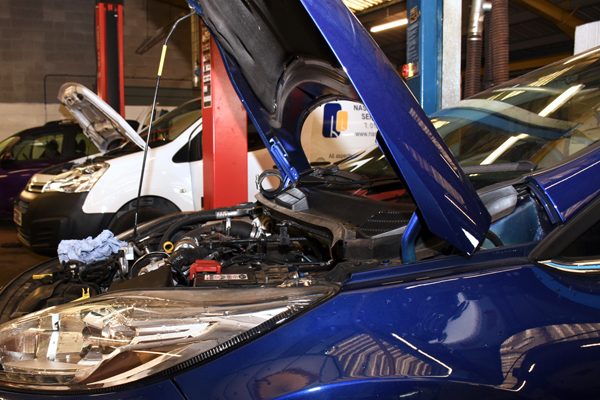 Engine bay of a car being worked on
